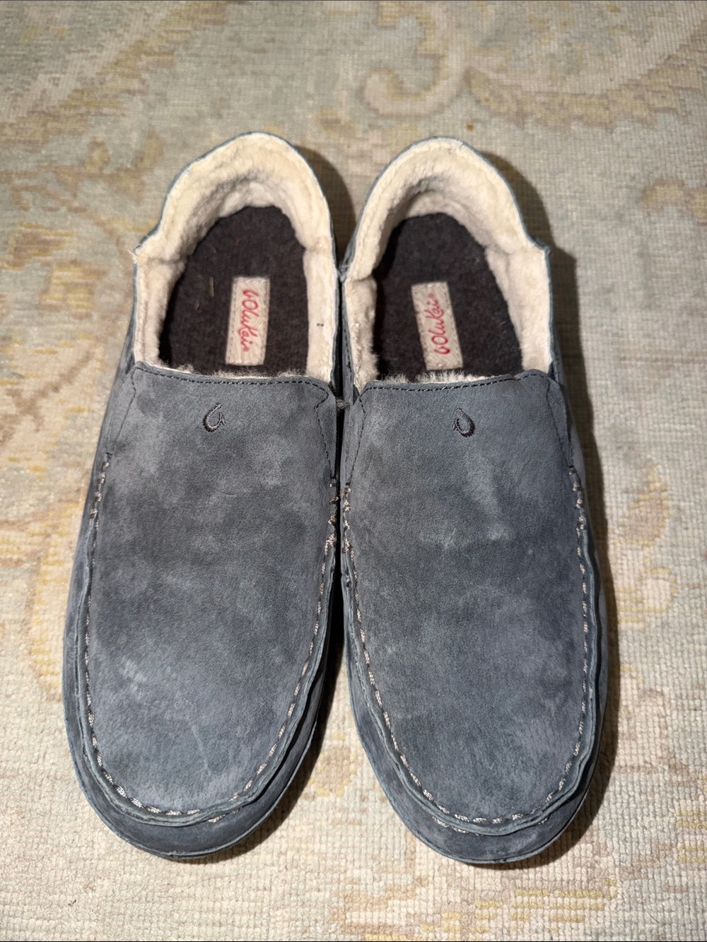 OluKai house slippers.